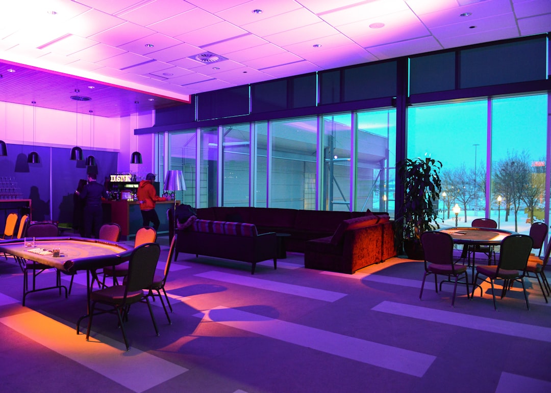 a room with a lot of tables and chairs